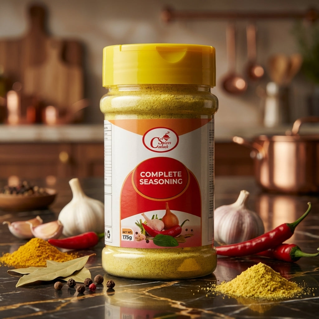 Spice jar labeled 'Complete Seasoning' on a kitchen counter with ingredients.